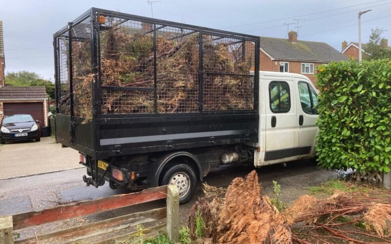 Garden clearance team loading green waste