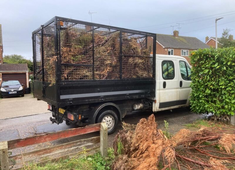 Garden clearance team loading green waste